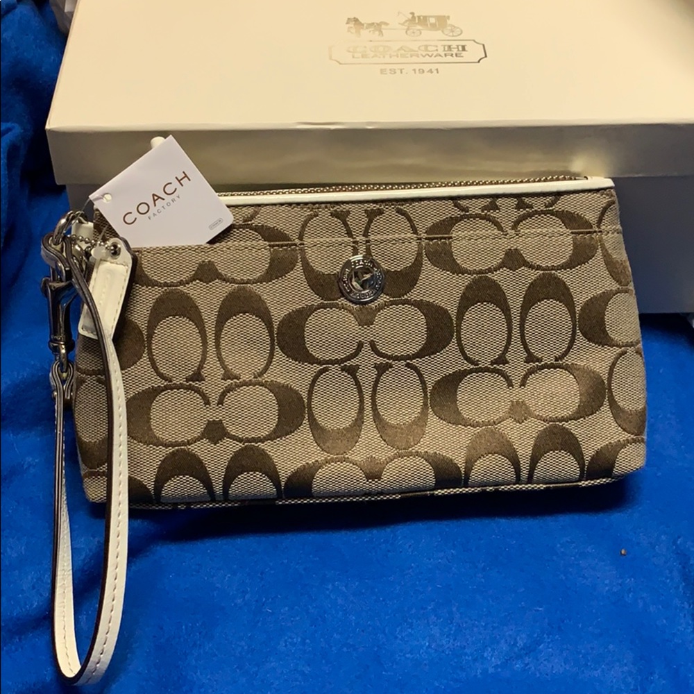 Coach wristlet/clutch signature and off-white NWT